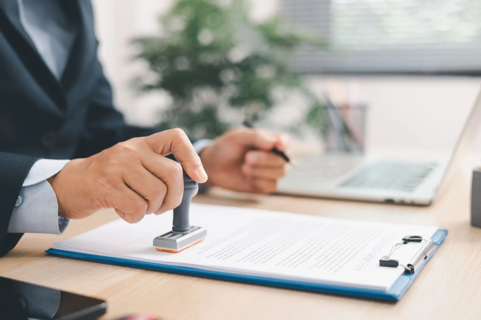 a man stamping a document