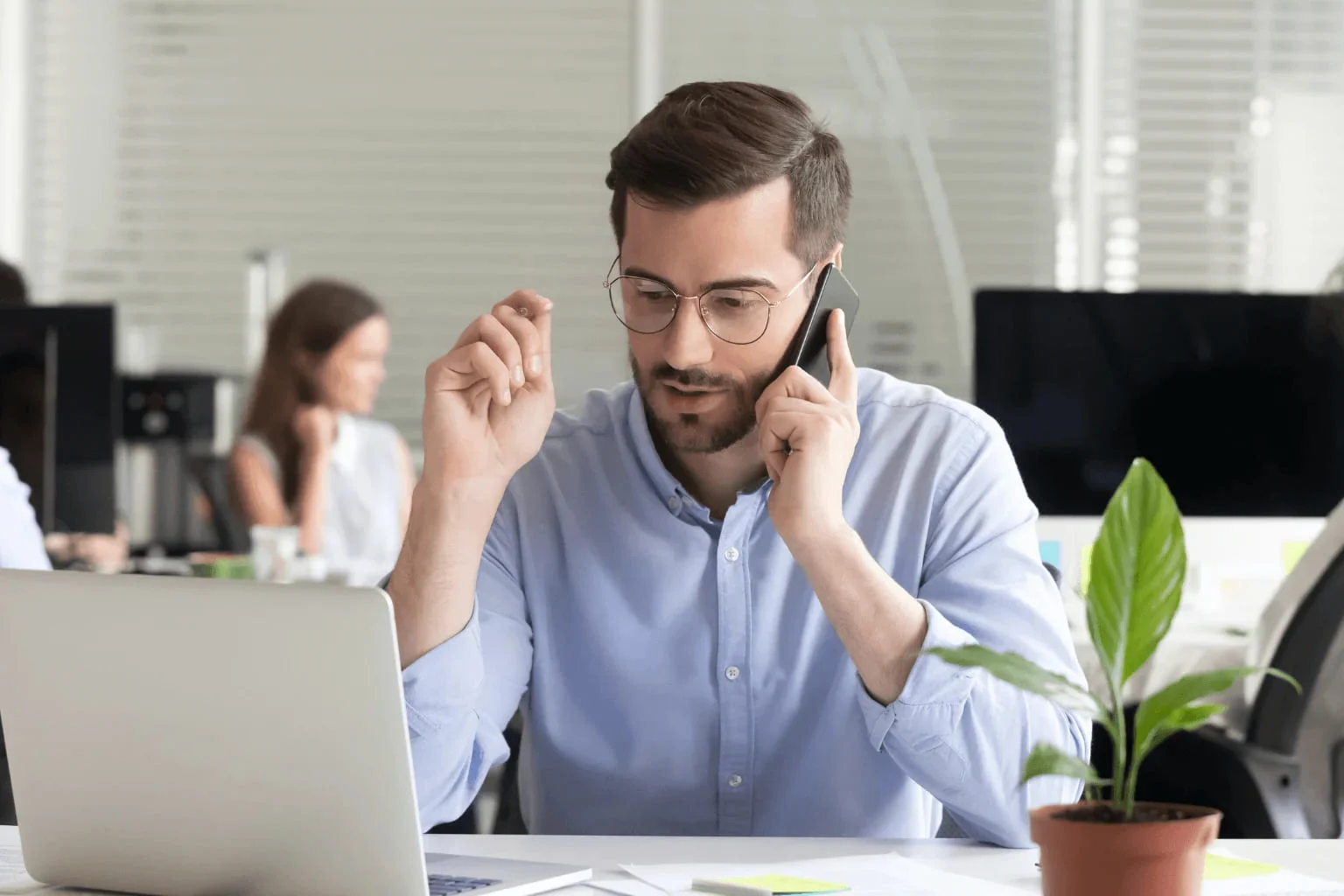 Clayton Realtor making prospecting calls at a desk